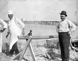 Beach event -- Men with sawhorse