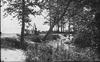 Man in woods by lake front