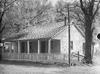 Roadhouse(?), trees and  telephone poles